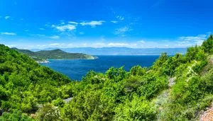 Wonderful romantic summer afternoon landscape panorama coastline Adriatic sea. The magical clear transparent azure water in the bay. Krk island. Croatia. Europe.